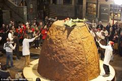 This Morning audience watch in silence as Holly tries to seperate itself from giant fruitcake.