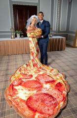 Nobody was surprised by her dress. Rumours had been circulating for a long time that she had something in the oven.